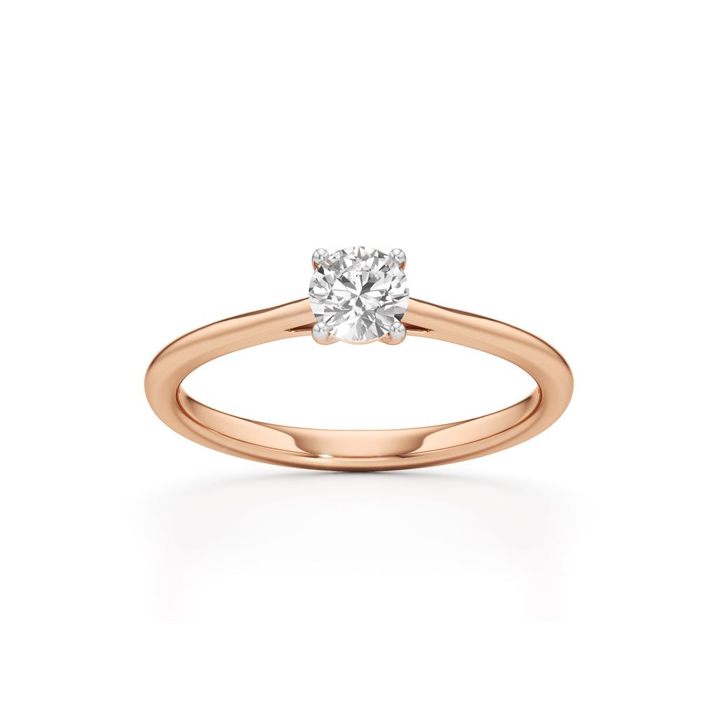 Solienara four prong round cut solitaire ring
